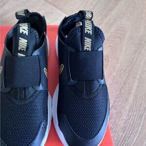 Nike Kids Black and Gold Slip-On Sneakers